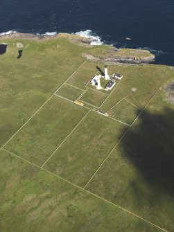 Oblique aerial view of the Muckle Skerry lighthouse, taken from the SE.