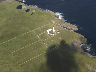Oblique aerial view of the Muckle Skerry lighthouse, taken from the ESE.