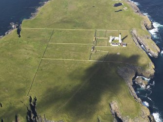 Oblique aerial view of the Muckle Skerry lighthouse, taken from the E.