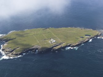 General oblique aerial view of the Muckle Skerry lighthouse, taken from the NE.