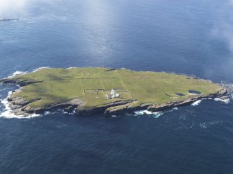 General oblique aerial view of the Muckle Skerry lighthouse, taken from the NNE.