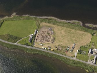 Oblique aerial view of the excavations at the Ness of Brodgar, taken from the NNE.