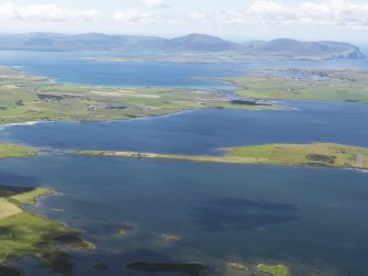 General oblique aerial view looking across the Lochs of Harray and Stenness with Hoy in the distance, taken from the NNE.