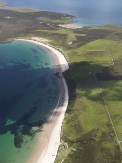 General oblique aerial view looking along the beach of Fersness Bay towards London Airport, Eday, taken fromthe WSW.