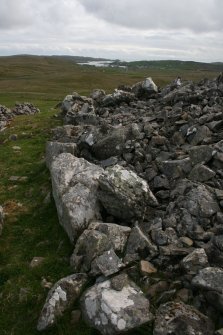 Detail of kerb on the SE side of the cairn taken from the NE.