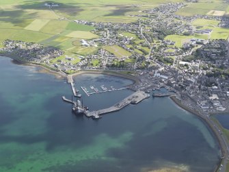 General oblique aerial view of Kirkwall looking across the harbour, taken from the WNW.