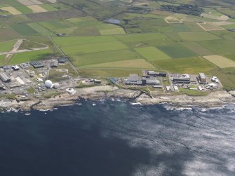 General oblique aerial view of the Dounreay Nuclear Research Facility, taken from the NW.