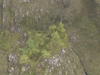 Oblique aerial view of the remains of the township of Poulouriscaig, taken from the NNW.