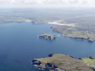 General oblique aerial view looking across Neave Island from Eilean nan Ron with Bettyhill in the distance, taken from the NW.