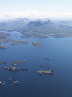 General oblique aerial view of Eddrachllis Bay with Quinag beyond, taken from the NNW.