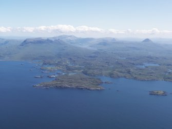 General oblique aerial view of Eddrachllis Bay looking towards Oldany Island with Quinag and Canisp beyond, taken from the NW.