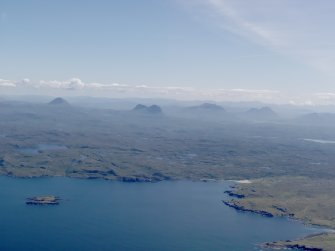 General oblique aerial view of Clashnessie Bay with Canisp, Suilven and Cul Mor beyond, taken from the NW.