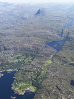 General oblique aerial view of Badnaban looking towards Loch Bad na Muirichinn with Suilven in the distance, taken from the WNW.
