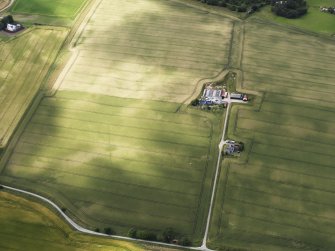 Oblique aerial view centred on the cropmarks of the possible quarry, taken from the SE.