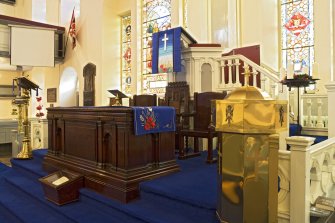 Interior. View of communion table, pulpit and font