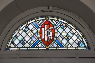 Interior. Ground floor, detail of stained glass fanlight