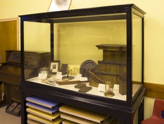 Interior. View of glass case containing Glasite items
