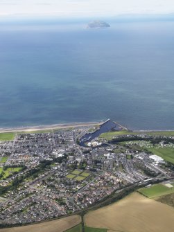 General oblique aerial view of Girvan with Ailsa Craig beyond, looking W.