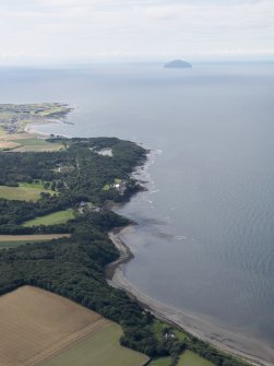 General oblique aerial view of the Ayrshire coast with Culzean Castle in the middle distance and Ailsa Craig beyond, looking SW.