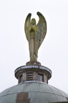 Angel sculpture atop dome. Detail