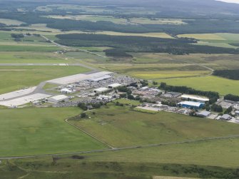 Oblique aerial view of Dalcross Airfield, Inverness, looking S.