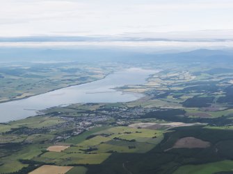 General oblique aerial view of the Cromarty Firth with Alness in the middle distance, looking WSW.