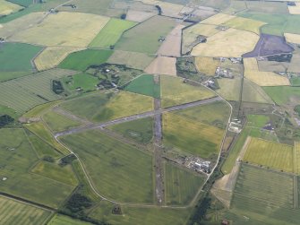 Oblique aerial view Fearn Airfield, looking NE.