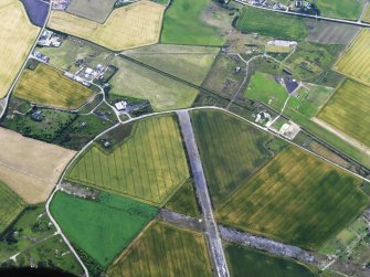 Oblique aerial view of Fearn Airfield, looking ESE.