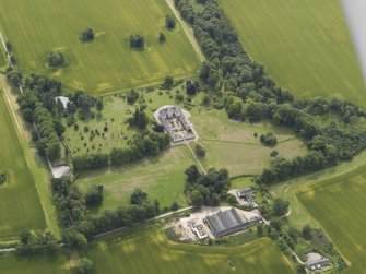 Oblique aerial view of Foulis Castle and policies, looking SE.