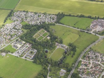 Oblique aerial view of Culloden House and gardens, looking N.