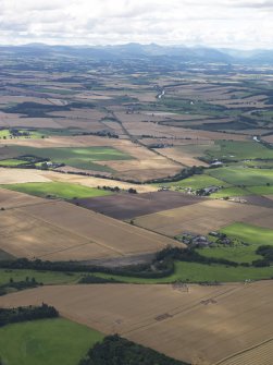 General oblique aerial view of the Glasgow University excavations of the Forteviot complex of sites, looking to the WSW.