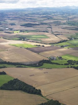 General oblique aerial view of the Glasgow University excavations of the Forteviot complex of sites, looking to the W.