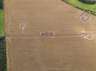 Oblique aerial view of the Glasgow University excavations of the Forteviot complex of sites, looking to the SW.