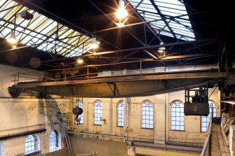 Interior. Main Range (Building 2) west end, 40 Ton crane (Crane 2) with 'fish belly'  shaped lower chord with operator's cabin to right and cross traveller on left.