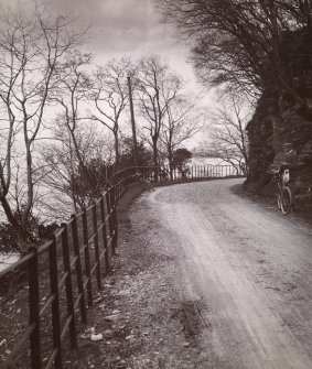 View of road with man and bicycles. 
Titled: 'Loch Lomond. 1904. Point of Firxxx & S R Turnbull'. 
