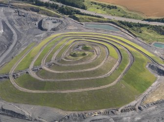 Oblique aerial view of Fife Earth Project at St Ninian's Open Cast Site, taken from the SW.