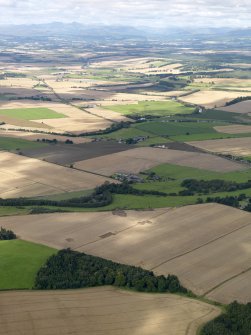 General oblique aerial view of the 2010 excavations at Forteviot with Strathearn beyond, taken from the ESE.