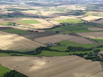 General oblique aerial view of the 2010 excavations at Forteviot with Strathearn beyond, taken from the ENE.