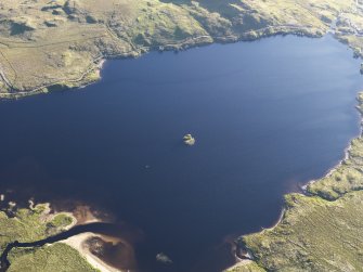 Oblique aerial view of the crannog in Loch Tearnait, looking SSW.