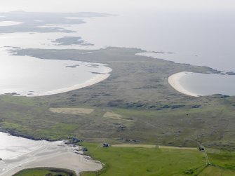 General oblique aerial view with Breachacha House, Col, in the foreground and Crossapol Bay, Feall Bay and Tiree beyond, looking to the W.