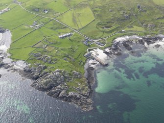 Oblique aerial view of Hynish, Tiree, looking to the WNW.