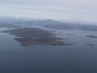 General oblique aerial view of Gometra and Ulva with Ben More in the distance, looking to the ESE.