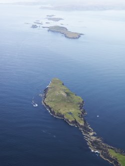 General oblique aerial view of Bac Mor (Dutchman's Cap) and Bac Beag with Lunga beyond, looking to the NE.