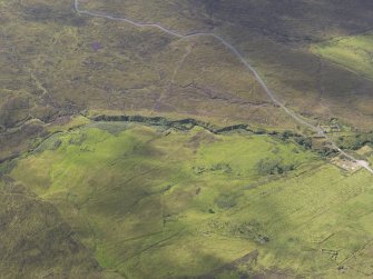 Oblique aerial view of the buildings, looking SSW.