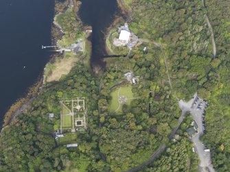 Oblique aerial view of Dunvegan Castle and gardens, looking NNW.