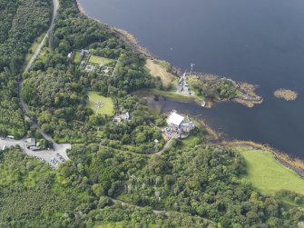 Oblique aerial view of Dunvegan Castle and gardens, looking SW.
