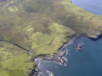 Oblique aerial view of the field system, lazy beds and head dyke at Ramasaig, looking S.