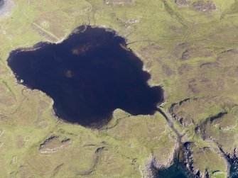 Oblique aerial view centred on Loch na h-Airde, the 'Viking Canal’ and the remains of the dun at Rubh' an Dunain, taken from the SW.
