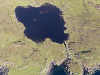 Oblique aerial view centred on Loch na h-Airde, the 'Viking Canal’ and the remains of the dun at Rubh' an Dunain, taken from the SSW.