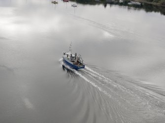 Oblique aerial view of a boat shortly after take off from Oban Airport, North Connel.